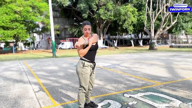 Busty Latina MILF Silvana Lee stretching in tight top and pants outdoors