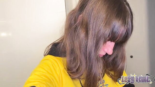 Lety Howl brunette with bangs in yellow hoodie closeup