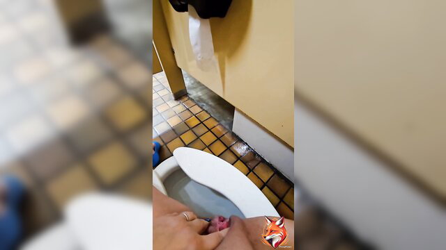Amateur woman fingering pussy in public bathroom stall