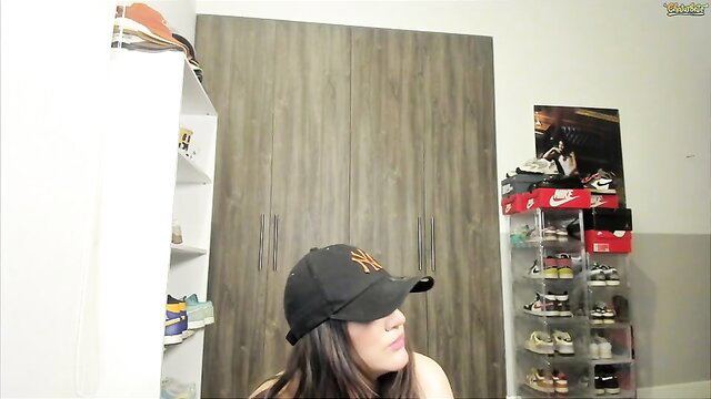 Curvy Asian bombshell in NY Yankees cap teases on webcam