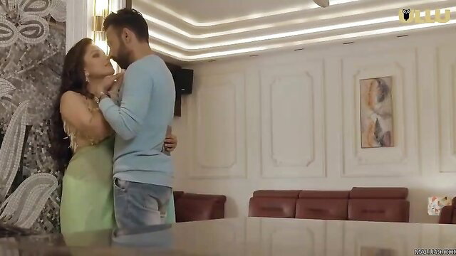 Indian couple embracing passionately in green dress, Ullu Kasturi Ep 5