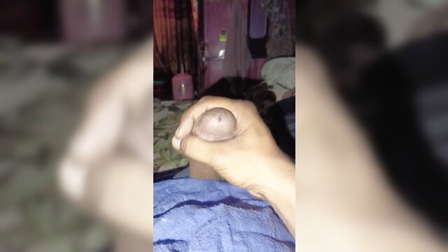 Closeup handjob on circumcised cock in amateur bedroom solo