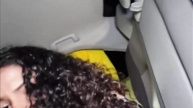 Gorgeous ebony teen with curly hair in yellow top inside car