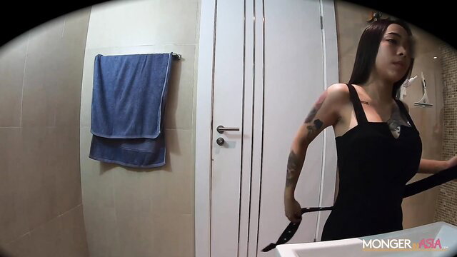 Rinrada tattooed Asian hooker in black dress in bathroom hidden cam