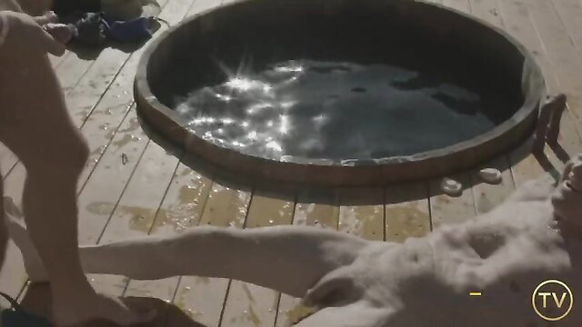 Calvin Banks stands over naked Max Adonis in steamy hot tub hookup