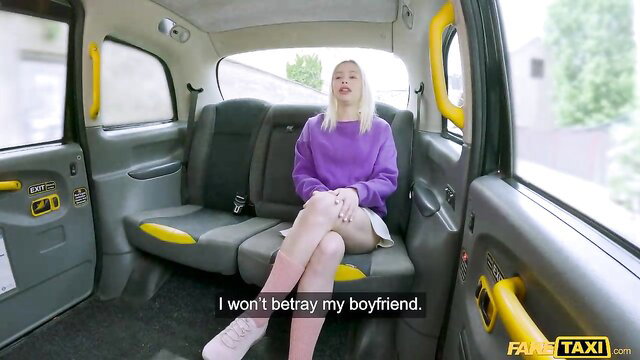 Vivian Lola faithful blonde in pink skirt on FakeTaxi cab seat