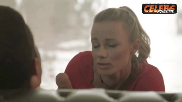 Blonde woman in red top gives close-up handjob in hot POV scene