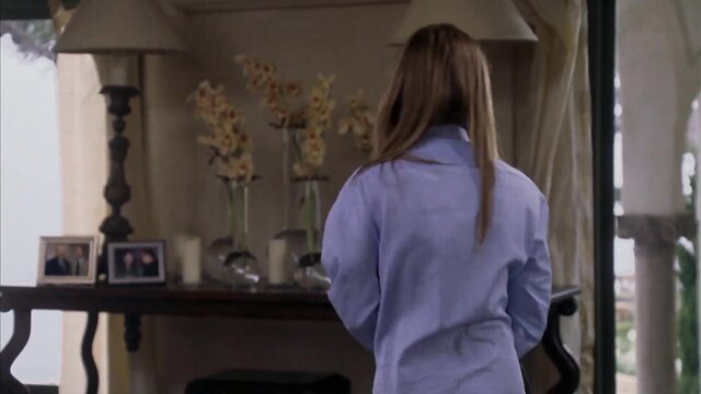 Jennifer Aniston back view in tight light blue shirt, sexy movie scene