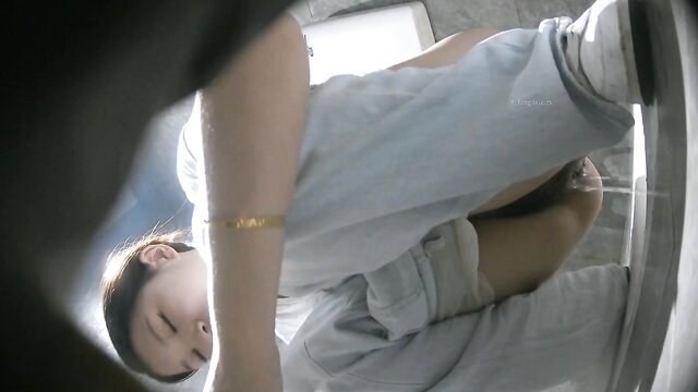 Asian girl squatting pissing in toilet voyeur closeup