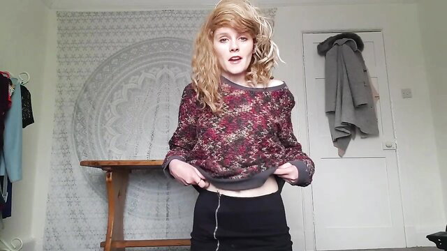 Sydney Harwin in sexy off-shoulder sweater and mini skirt, teasing pose