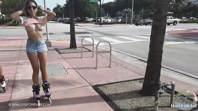 LilyKawaii braless in tiny shorts rollerblading topless on Miami street