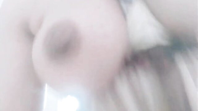 Blurry closeup of huge pale tits squeezed together for titfuck
