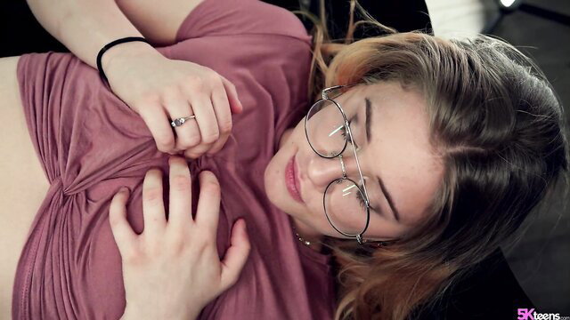 Taylor Blake in glasses grabs her perky tits under pink crop top