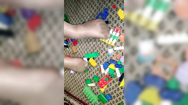 Hot babe's nylon soles walking on Lego bricks foot fetish