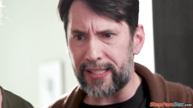 Handsome mature man with beard smirks intensely in StepFamSex preview