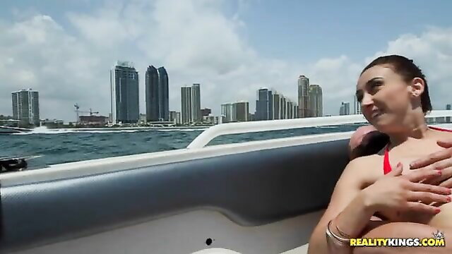 Sexy brunette in red bikini groped on boat with Miami skyline