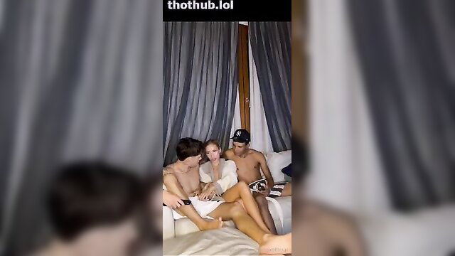 Hot 3some with topless Asian beauty and two nude hunks on couch