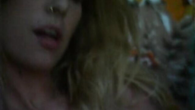 Closeup of blonde teen with nose piercing, parted lips in extreme classic porn