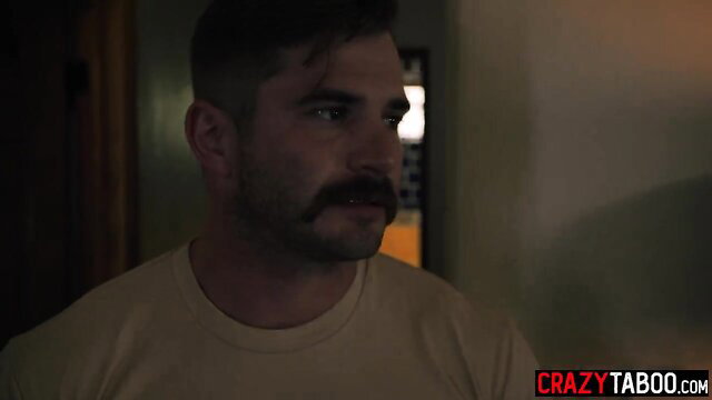 Laney Grey closeup in dimly lit room, sexy mustache man gaze