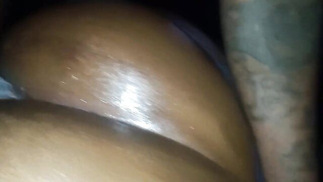 Thick ebony booty closeup with tattooed arm in hotel passion