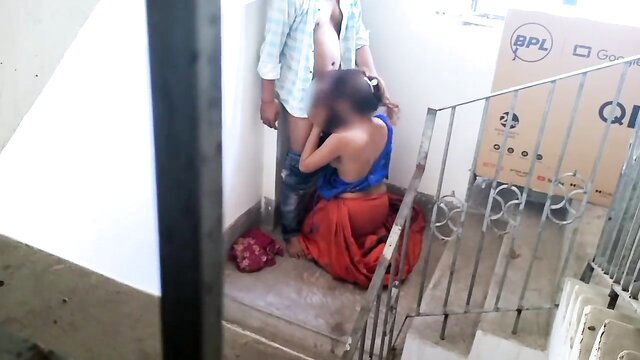 Desi Indian girl in saree kneels for blowjob on balcony stairs