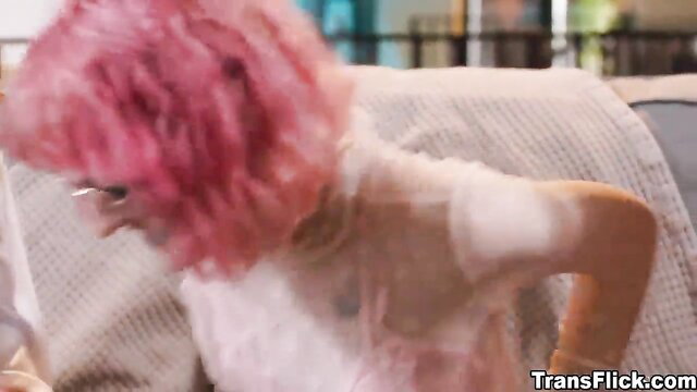 Pink-haired beauty in sheer wet lingerie, topless side profile tease