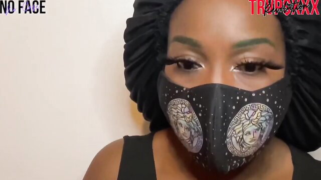 Black beauty in Versace mask and bonnet, sexy eyes tease