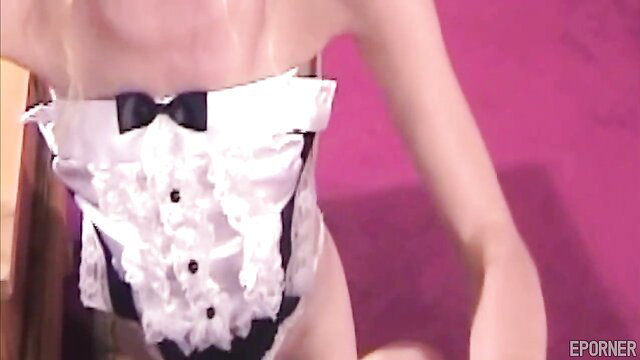 Busty Asian MILF in tuxedo lingerie poses seductively