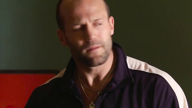 Amy Smart closeup portrait in dark track jacket necklace