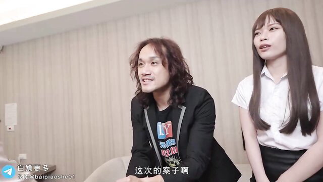 Asian office lady in schoolgirl uniform with long-haired boss on business trip