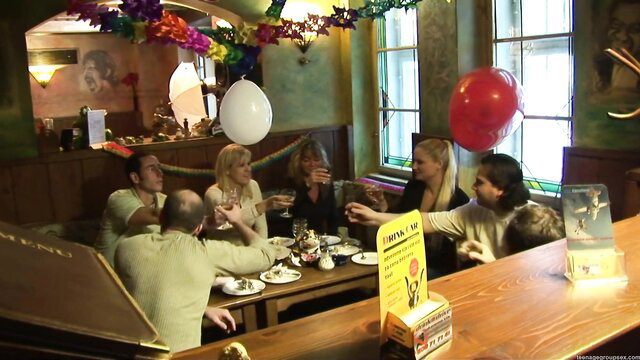 Blonde and brunette party girls in group drinking and teasing dirty fun