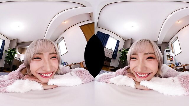 Blonde Asian beauty smiling in fluffy robe, POV VR tease