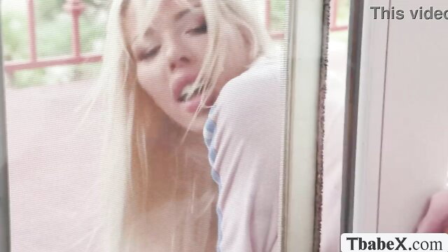 Brittney Kade blonde tgirl closeup face on balcony moaning