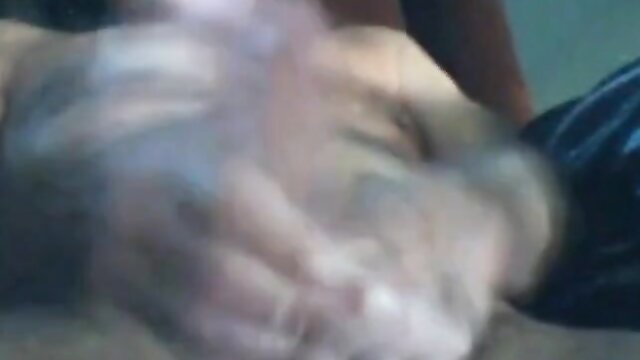 Blurry webcam closeup of thick older man's erect cock in hand, grandpa stroking