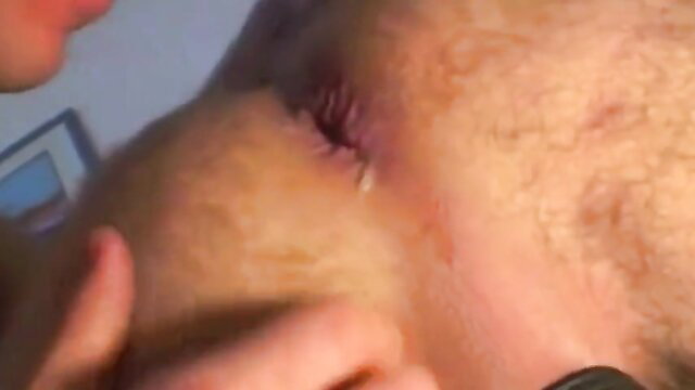 Closeup of woman's swollen red eye with cum dripping, intense facial aftermath