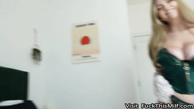 Busty blonde Angie Faith in green corset needs attention