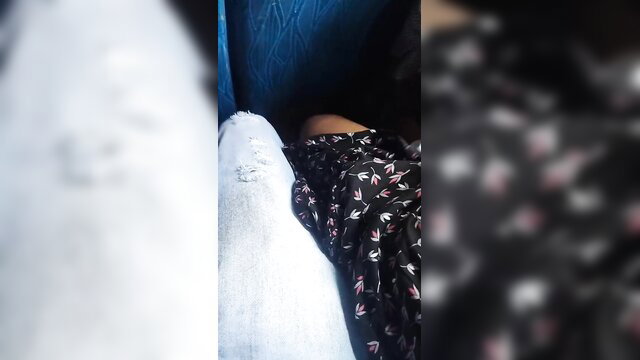 Blurry bus tease: woman flashes white pants under floral dress