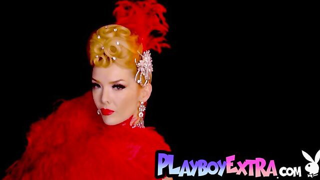 Blonde bombshell in slutty red burlesque costume with feathers
