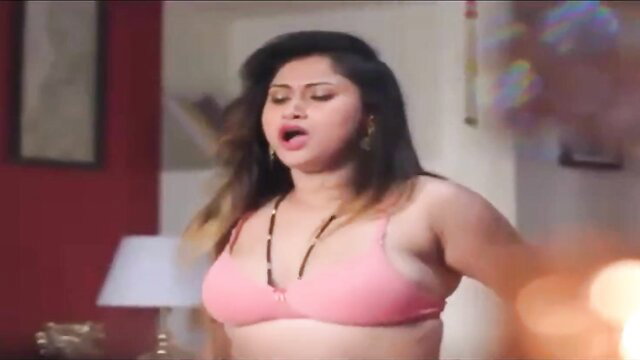 Curvy Indian MILF in pink bra, seductive bedroom tease