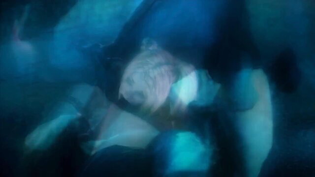 Blurry underwater nude women floating in Scarlet Nights JAV scene