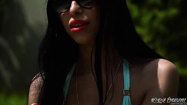 Hot black babe in teal bikini sunglasses smirking seductively outdoors