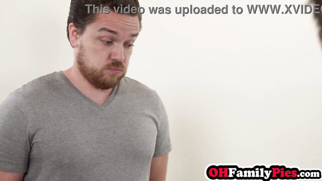 Bearded man in gray V-neck shirt looking surprised in adult video thumbnail