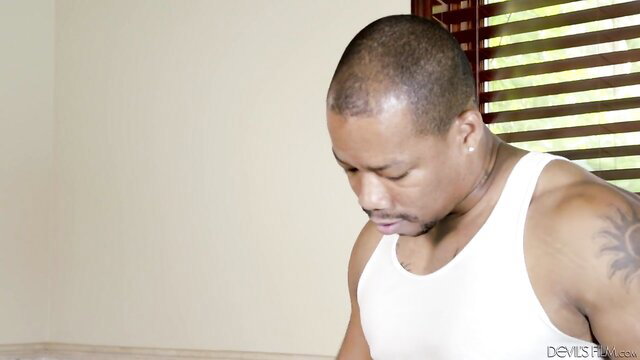 Muscular black man in tank top, closeup face view from Devils Film