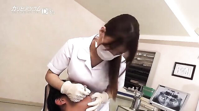 Asian nurse in uniform gives injection to patient in JAV dentist clinic