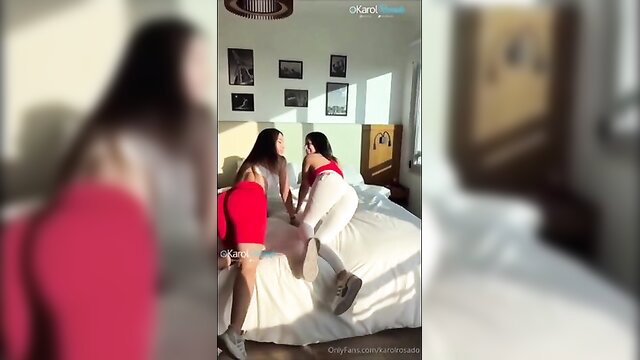 Two glamorous Asian girls in hot lesbian play on bed