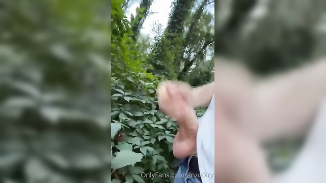 Cute big cock Enzo stroking outdoors in bushes