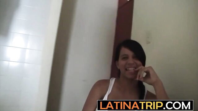 Smiling Latina amateur teen in tank top poses playfully
