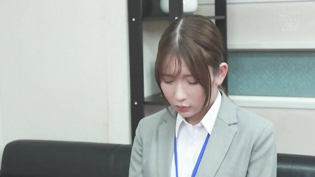 Melancholy Japanese office lady in suit, serious expression, JAV thumbnail