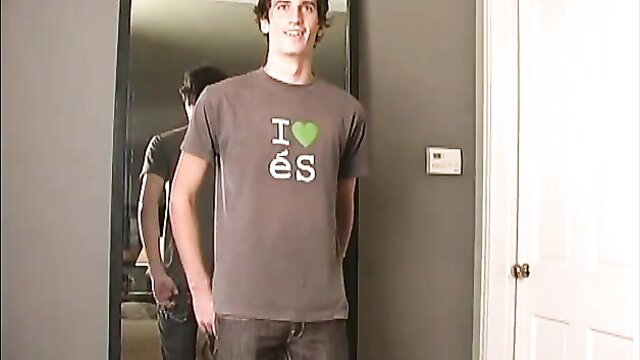 Cute college boy with 'I ♥ É s' t-shirt posing in mirror selfie