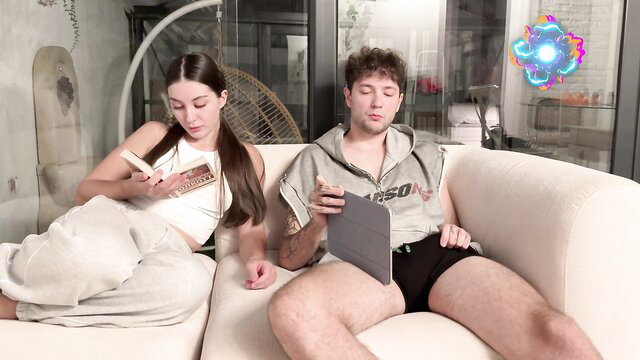 Stepbro jerks off next to hot stepsis on couch, she catches him horny